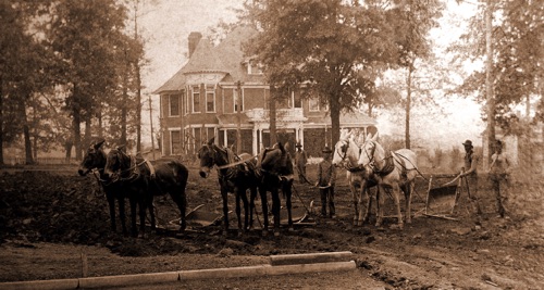 President Palmer's impressive home on the Alabama College campus. Workers preparing the site for the east wing expansion of Main Dorm. Palmer's house burned in 1921and was replaced by the house at Flower Hill in 1926. President Palmer's impressive home on the Alabama College campus. Workers preparing the site for the east wing expansion of Main Dorm. Palmer's house burned in 1921and was replaced by the house at Flower Hill in 1926.